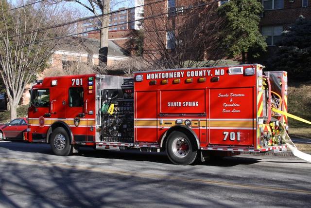 Engine 701 laying out some hose.